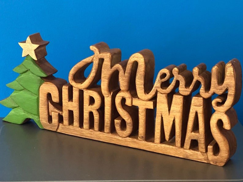 Wooden carved Merry Christmas decoration 38 cm long with Tree and Star - 1326722459 Toy Chest Australia 1