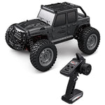 Black remote control off road ride on car for kids with large knobby tires and handheld transmitter