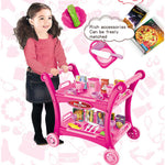 Pink children's play kitchen cart set with toy cups plates utensils shelves and girl pushing it