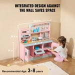 Pink wooden kids kitchen playset Australia with stove sink shelves and girl playing on floor
