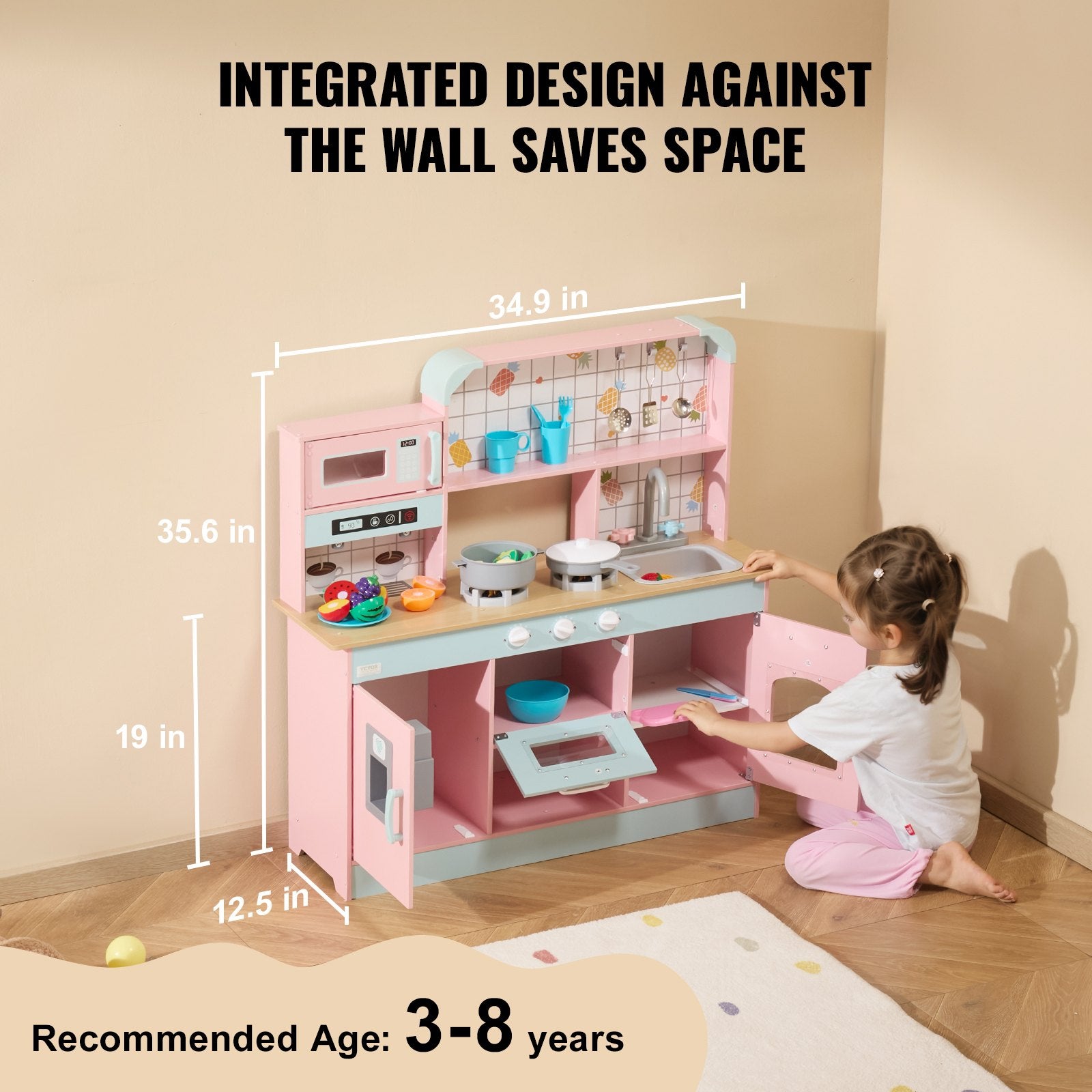 Pink wooden kids kitchen playset Australia with stove sink shelves and girl playing on floor