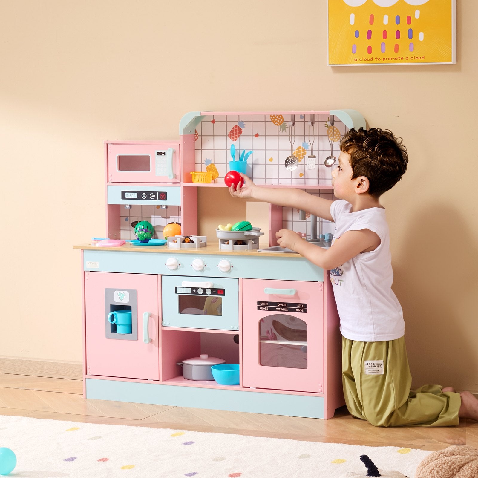 Child playing with pastel wooden kids kitchen playset Australia with oven microwave and accessories