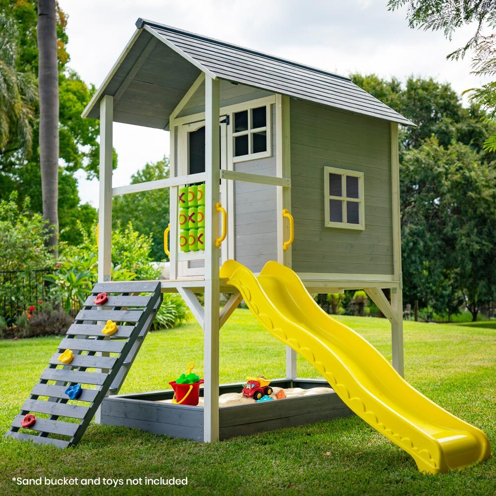 Elevated wooden cubby house with slide Australia playhouse with yellow slide rock climbing ramp and sandpit