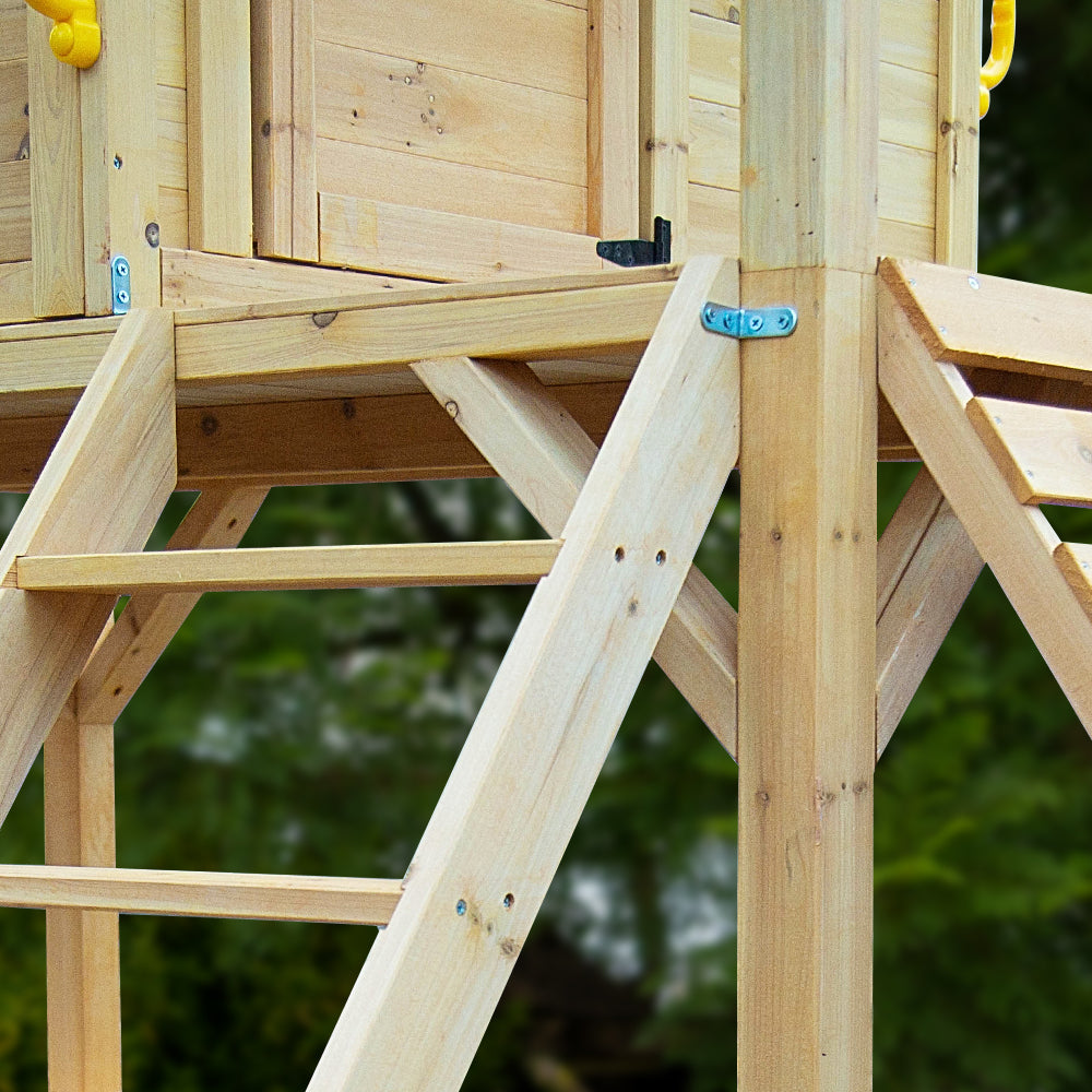 Close up of timber ladder and support beams on a playset wooden cubby house with slide Australia